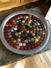 Some of the Best Champagne Caps galore displayed in an 18 inch tray.